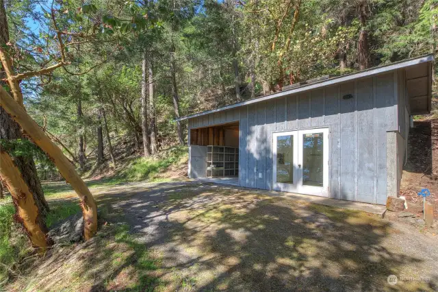 Detached carport #2 and custom shop. Water and electricity on site.
