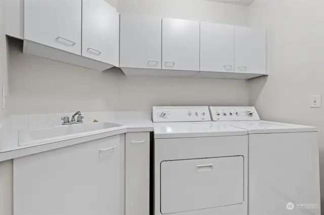 Great size laundry room with cabinets and deep sink. This room is adjacent to a roomy mechanical room.