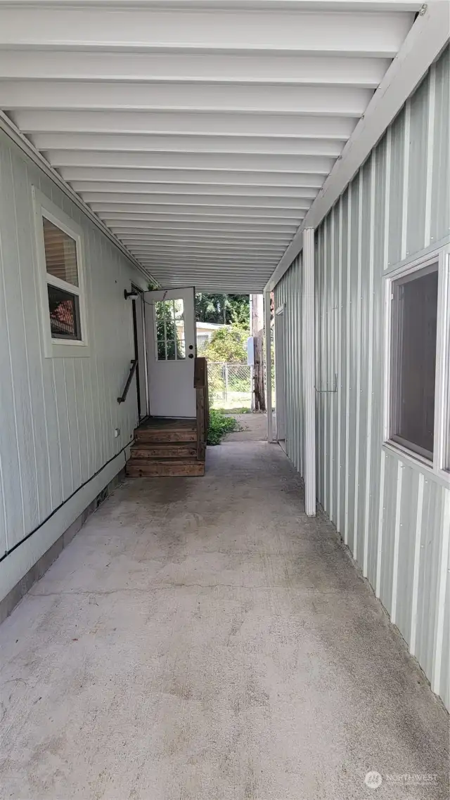 Covered breezeway between house and garage.