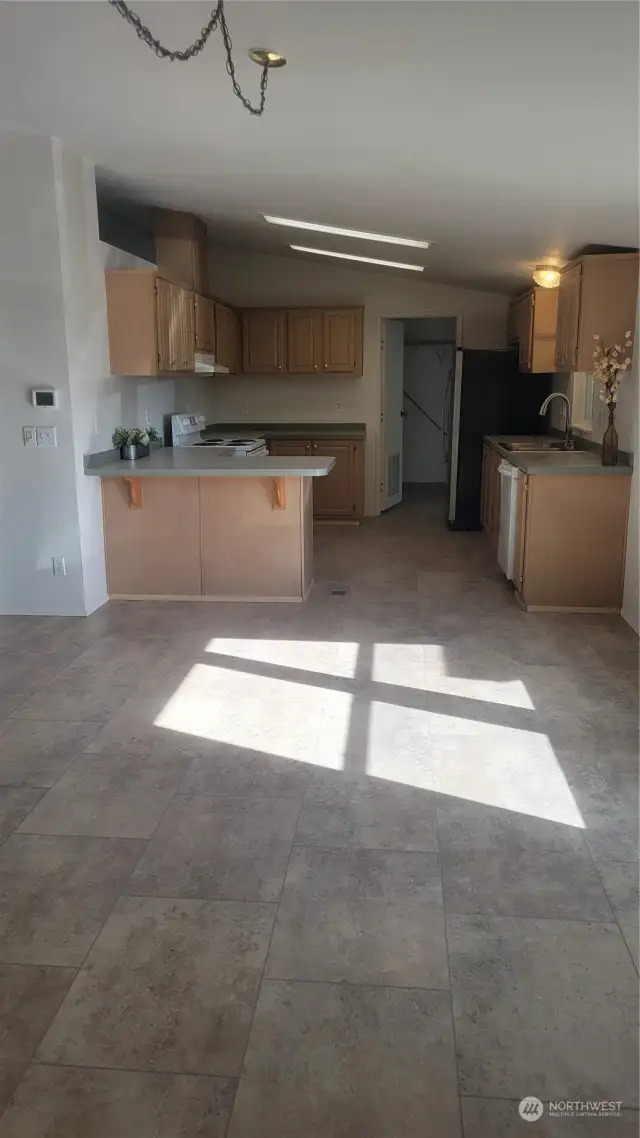 Laminate tile in dining and kitchen.