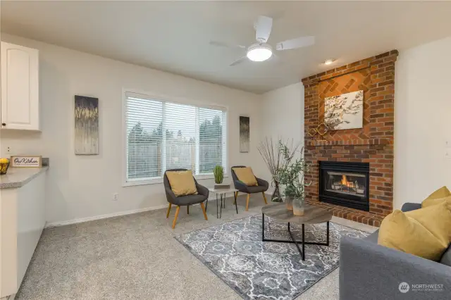 Family room next to the kitchen, with another gas fireplace