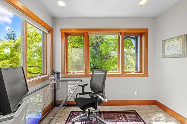 Tree top views from your cozy home office makes for a relaxing space