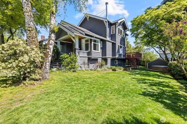 Plenty of Yard to enjoy with lilac trees, rose bushes, hydrangeas, and more gardening space