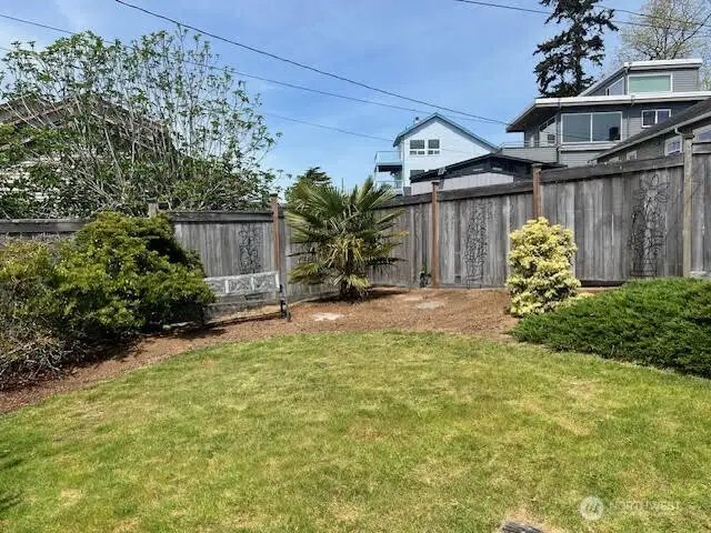 The side yard has garden space.