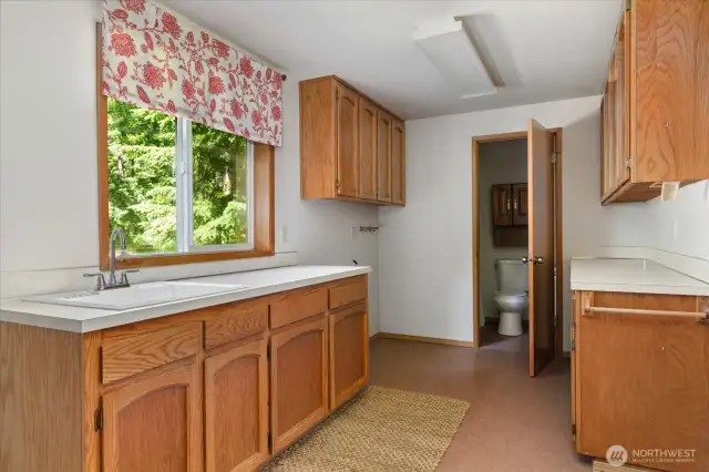 The laundry/mud room is right off the kitchen with access to the garage.