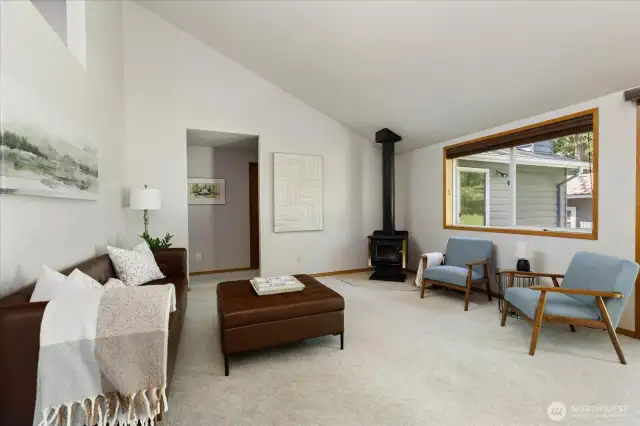The living room has a wonderful free-standing wood stove.
