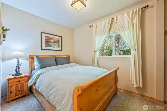 Comfortable queen bedroom with ample closet space.
