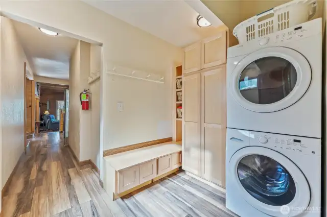Functional entryway with mudroom area and included washer and dryer for convenience.