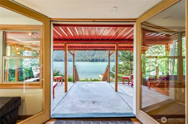 Covered patio off the basement with comfortable seating, perfect for year-round relaxation.
