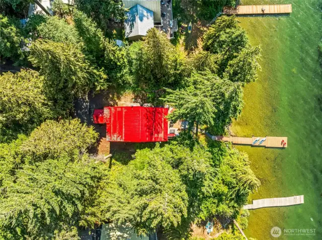 Aerial view showcasing the beautiful 0.40-acre lot and Fish Lake waterfront