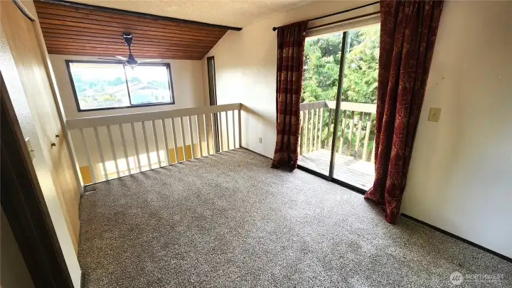 With sliding door to small deck
