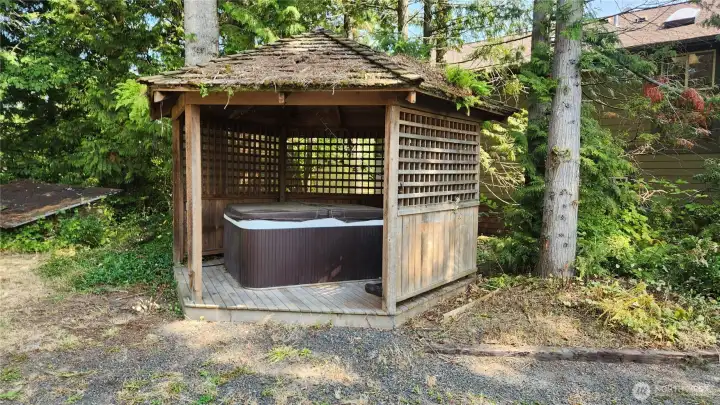 Gazebo with hot tub, needs some TLC