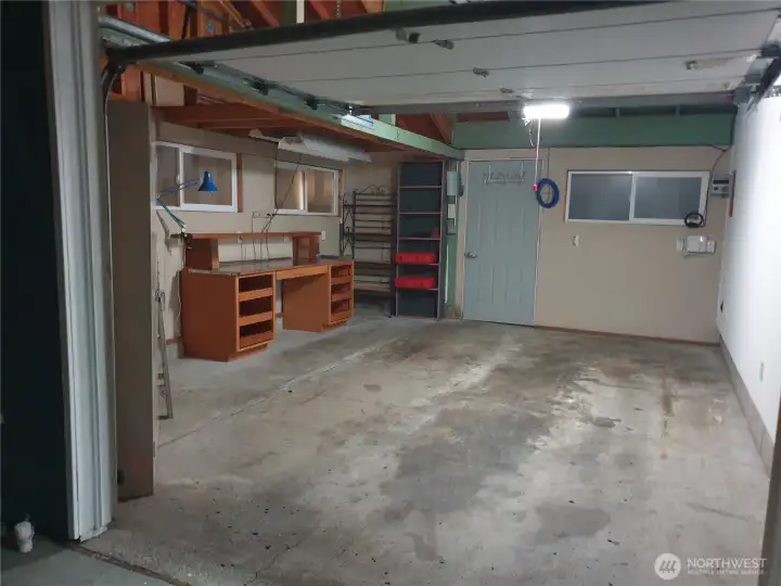 Main House oversized garage with work or storage area.