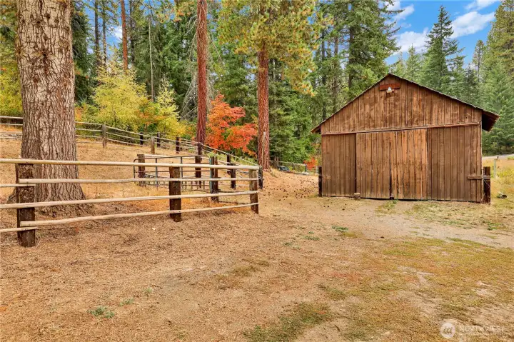 Barn with hay storage and feeding troughs