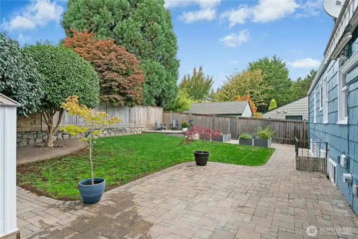 Fully fenced backyard has paver patio, electric awning & easy care lawn. Fun for pets & kids of all ages here year round.