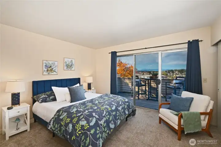 Primary bedroom with sliders to large, view deck