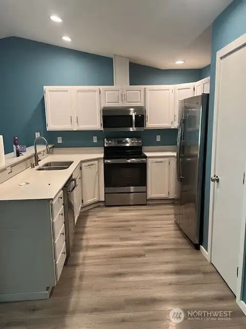 This lovely kitchen features stainless steel appliances that are perfect for the home and are built to last.