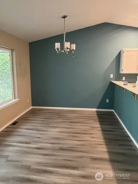 Welcome to the inviting dining area, a perfect space to enjoy delicious meals and good company. This charming setting promises a delightful dining experience every time you visit.