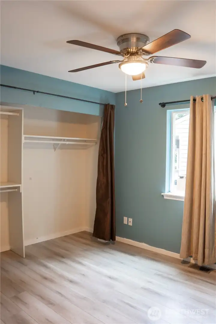 The second bedroom offers a spacious and inviting room, perfect for relaxing or entertaining