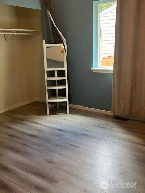 The second bedroom offers a spacious and inviting room, perfect for relaxing or entertaining