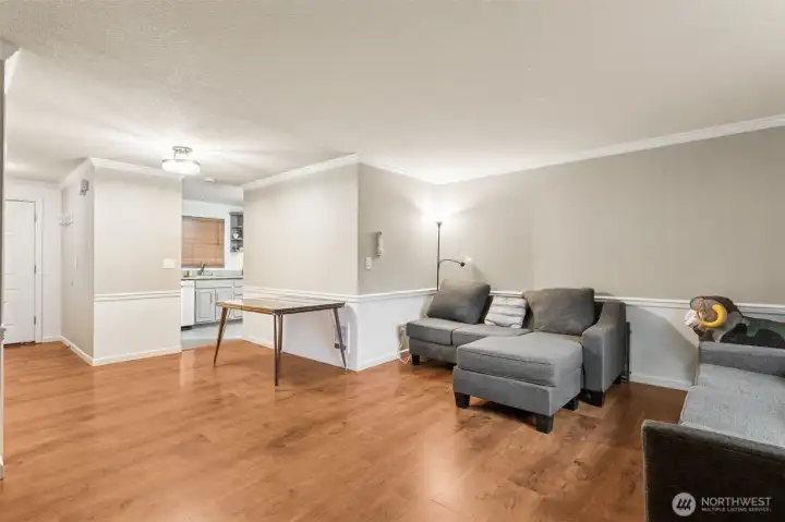 Living Room with wood fireplace & Dining Area off Kitchen