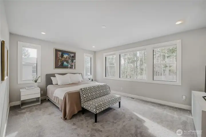 The expansive Primary Suite provides a relaxing, private escape, secluded from the rest of the home.