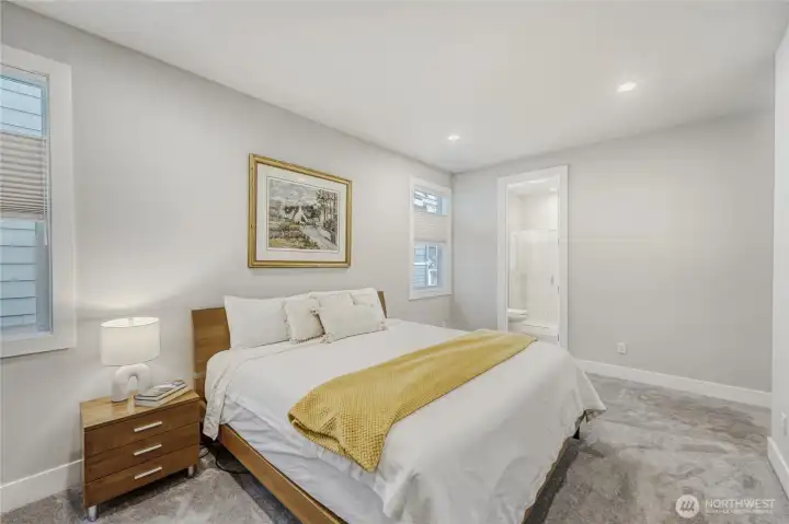 The second bedroom guest suite features a 3/4 en-suite bath and a walk-in closet.