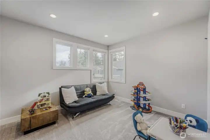 The fifth bedroom on the upper floor makes a terrific play/flex room with a walk-in closet for additional storage.