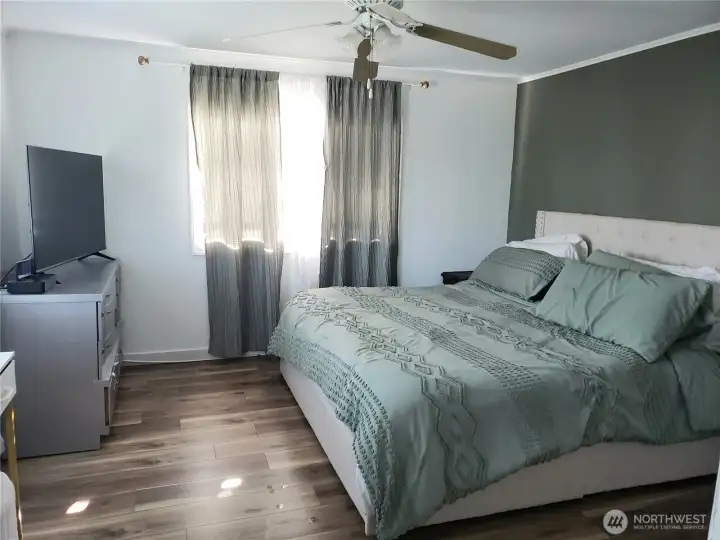 A View of the Spacious Primary Master Bedroom with Newer Paint, Trim and Vinyl Plank Flooring