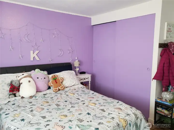 Another Picture of the Spacious Second Bedroom with Newer Paint, Trim, and Vinyl Plank Flooring Showing Closet.