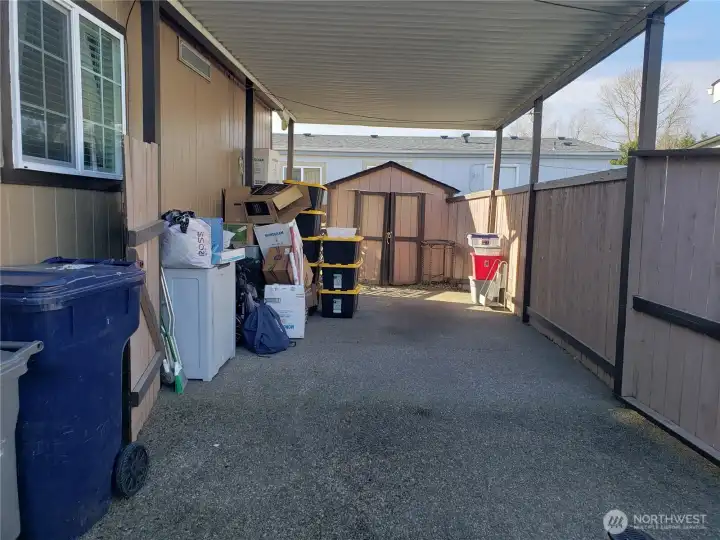 Huge Long Carport with Gated Entry and a nice Dry Storage Shed.