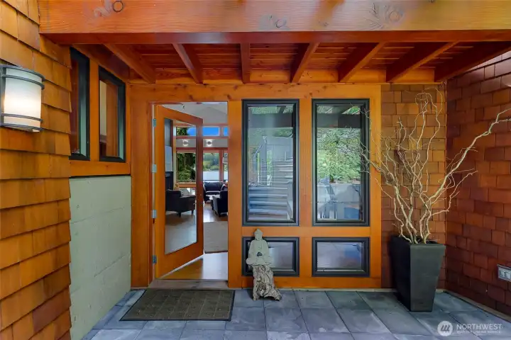 Main entrance, with shingle siding and fir-clad windows & doors.