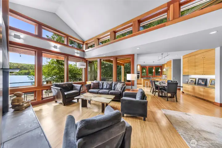 Custom woodwork and accent lighting elevate the warm, minimalist palette.