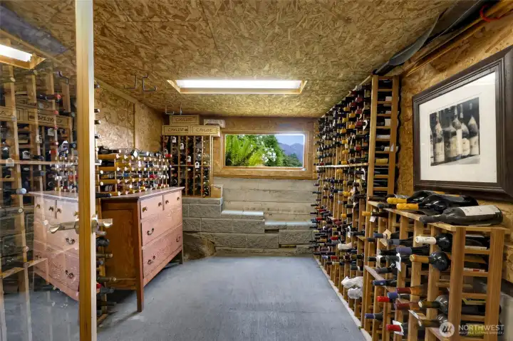 Basement features discreet & secure 500-bottle wine cellar + separate dry storage for your lake toys.