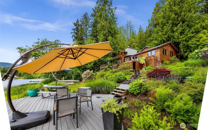 Lush landscaping designed by BearCreek Nursery. Stairs lead to hot tub, outdoor shower, and to the Primary Residence.