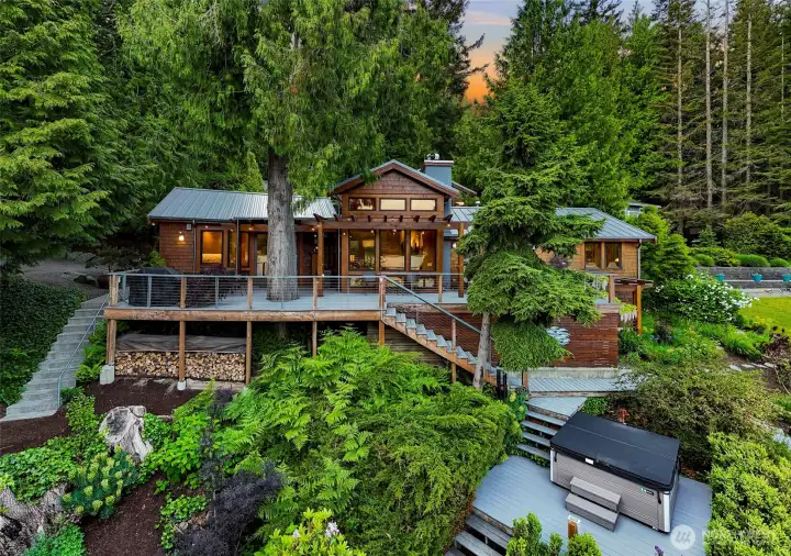 Lakeside, waterfront living on a double lot with 2 separate water rights.