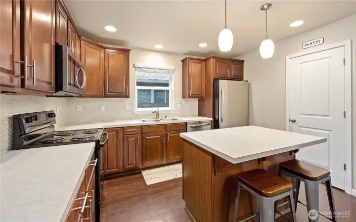 Kitchen with island bar seating