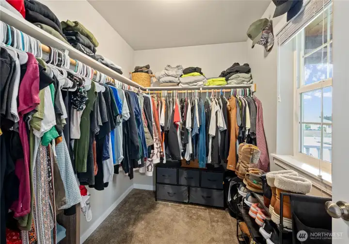 Primary bedroom walk in closet