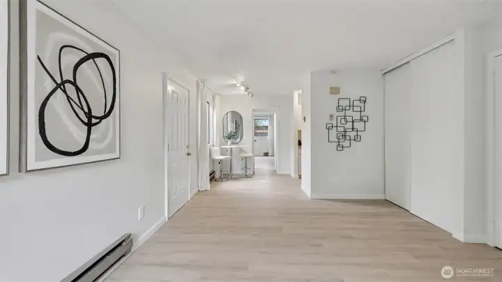 Living room is bright and open to kitchen and dining area. Two closets for extra storage with a side door and path leading to the back yard.
