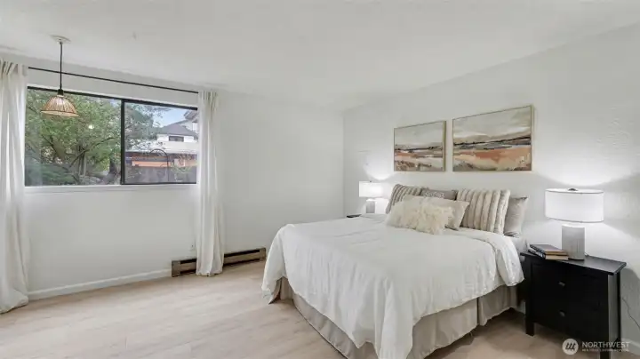 Huge bedroom includes a walk-in closet and room for home office or hobby desk.