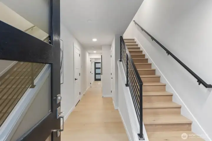 Greeted by warm engineered hardwood floors that create an inviting first impression.