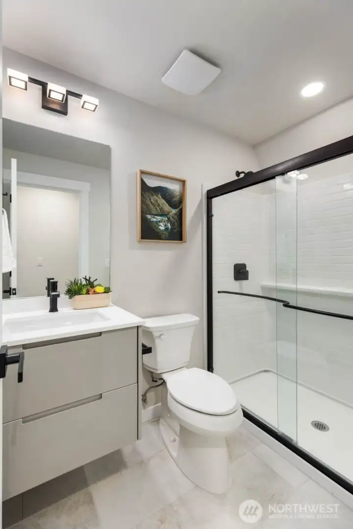 Main-level ¾ bathroom offers added flexibility and ease of living.