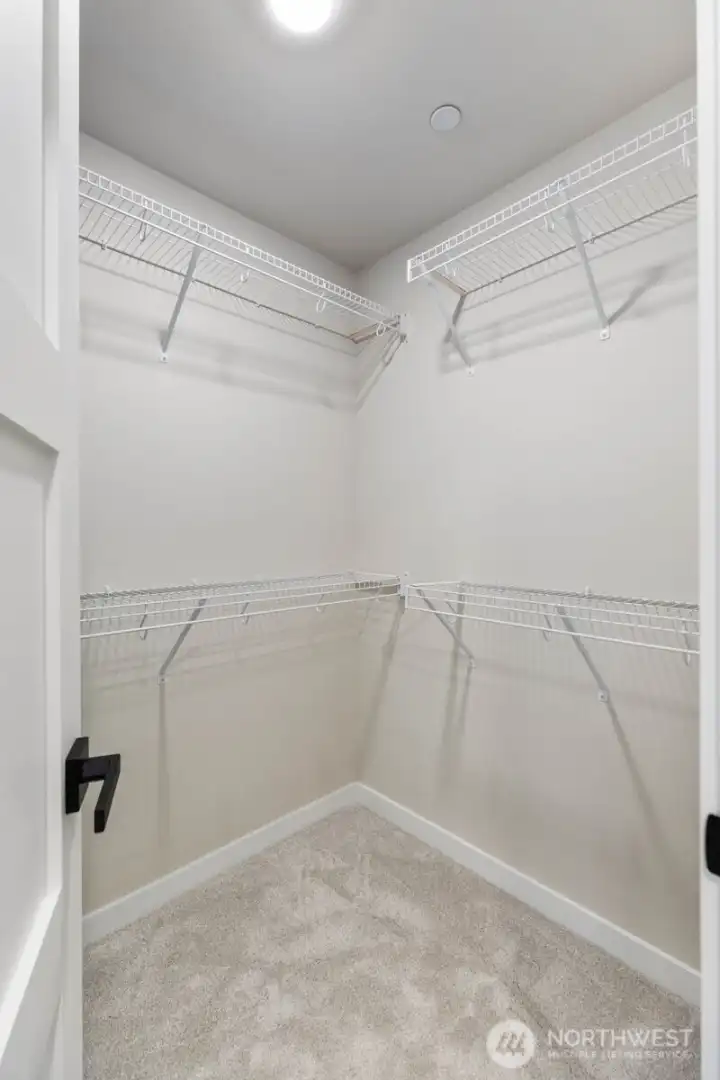 Primary walk in closet.