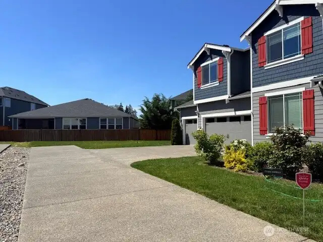 Side yard and even more parking