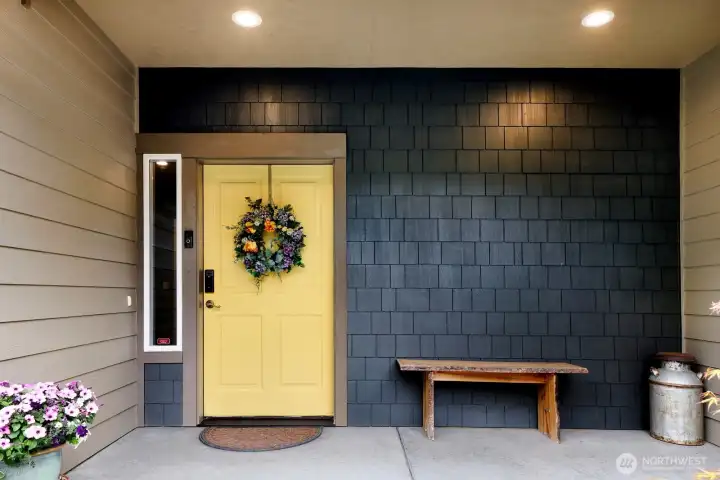 Covered front entry with space for seating or seasonal décor