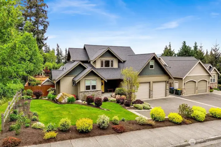 Front exterior with mature landscaping and strong curb appeal