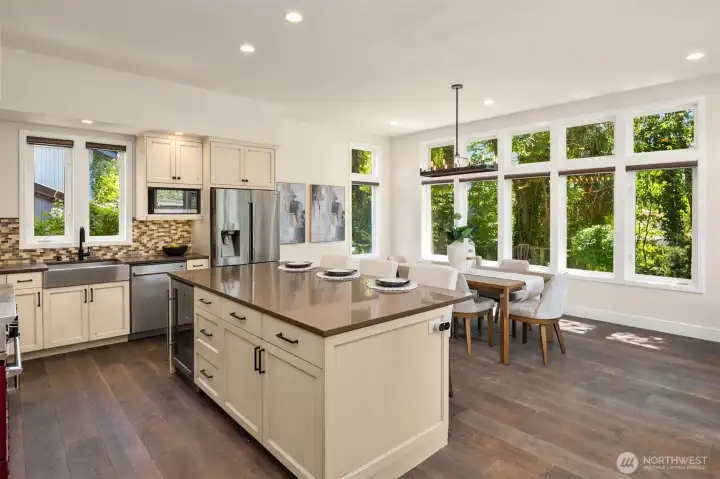 What an incredible open concept kitchen and dining room space!