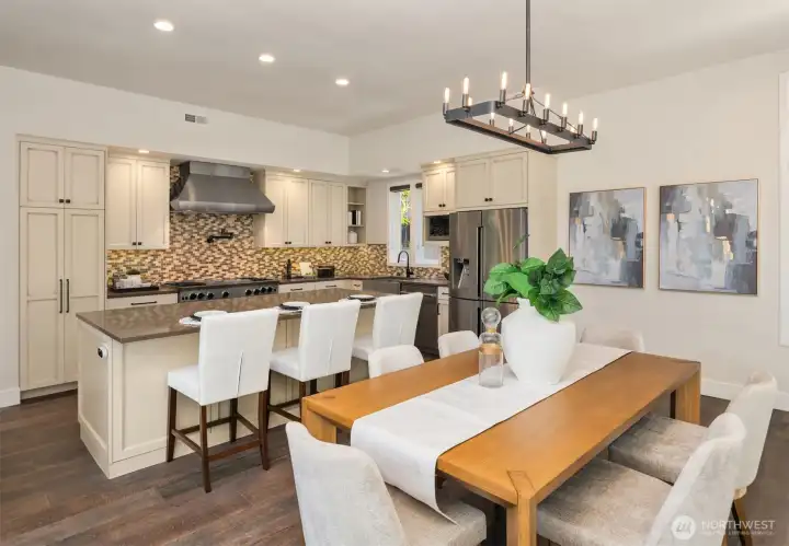 The kitchen and dining room offer multiple seating options.