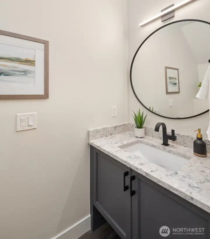 The updated half-bathroom on the main floor is tucked down the hall for privacy.