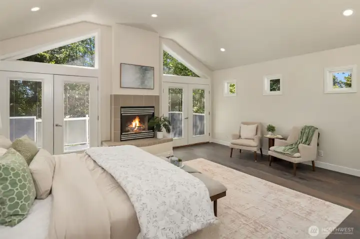 A wood-burning fireplace enriches the room.